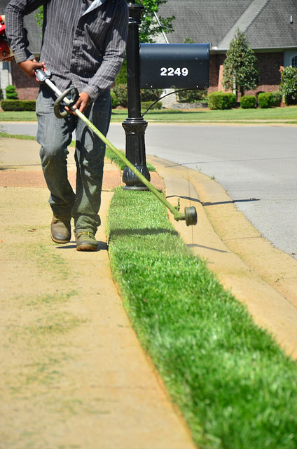 Rosa's Lawn Maintenance crew edging