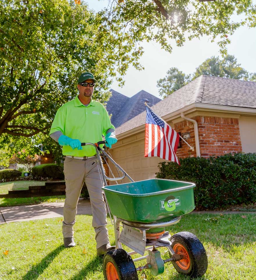 Rosa's Lawn Maintenance crew fertilizing